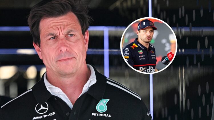 Toto Wolff looks on past the camera on the left with Max Verstappen talking to media in the media pen on the right