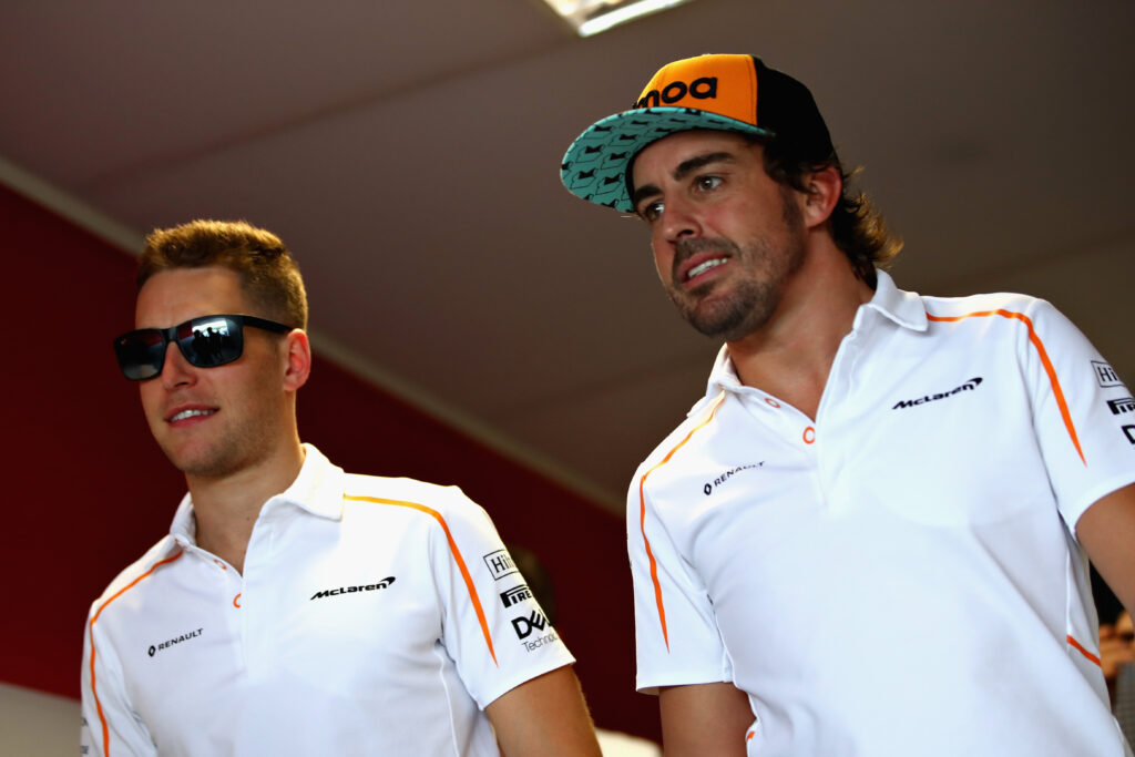 Stoffel Vandoorne and Fernando Alonso walk in the Paddock after practice