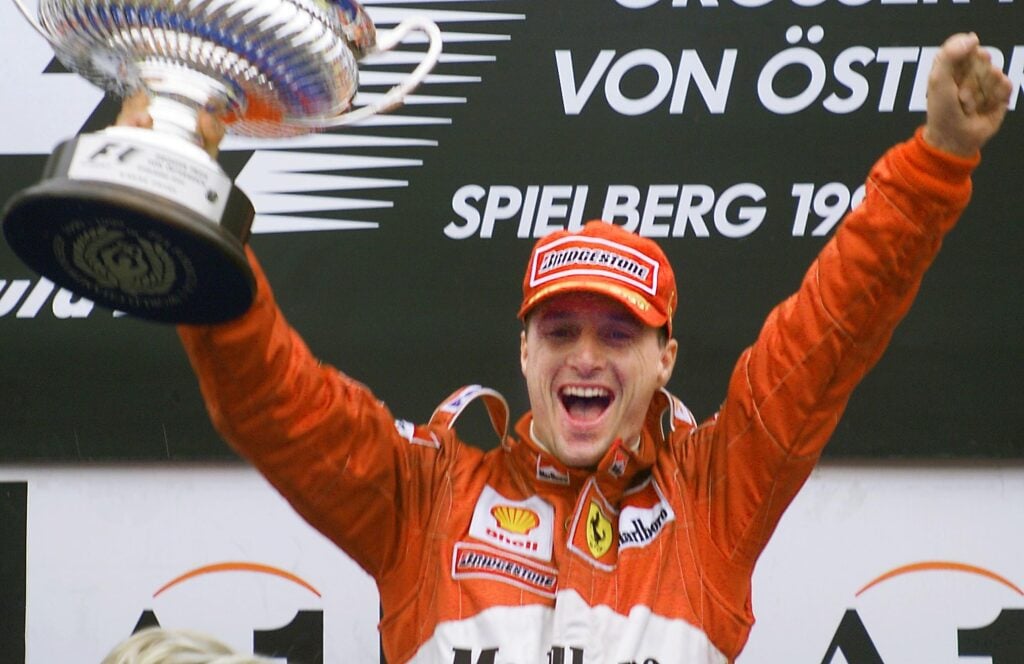Ferrari driver Eddie Irvine celebrating at the 1999 Austrian Grand Prix