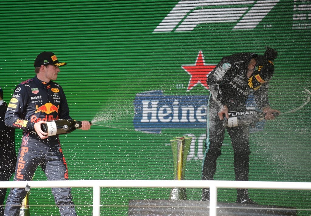 Max Verstappen and Lewis Hamilton celebrate on the podium at the 2021 Brazilian Grand Prix
