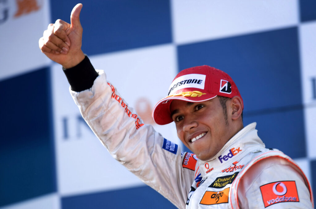 Lewis Hamilton celebrates on the podium after finishing third on his F1 debut for McLaren in the 2007 Australian Grand Prix