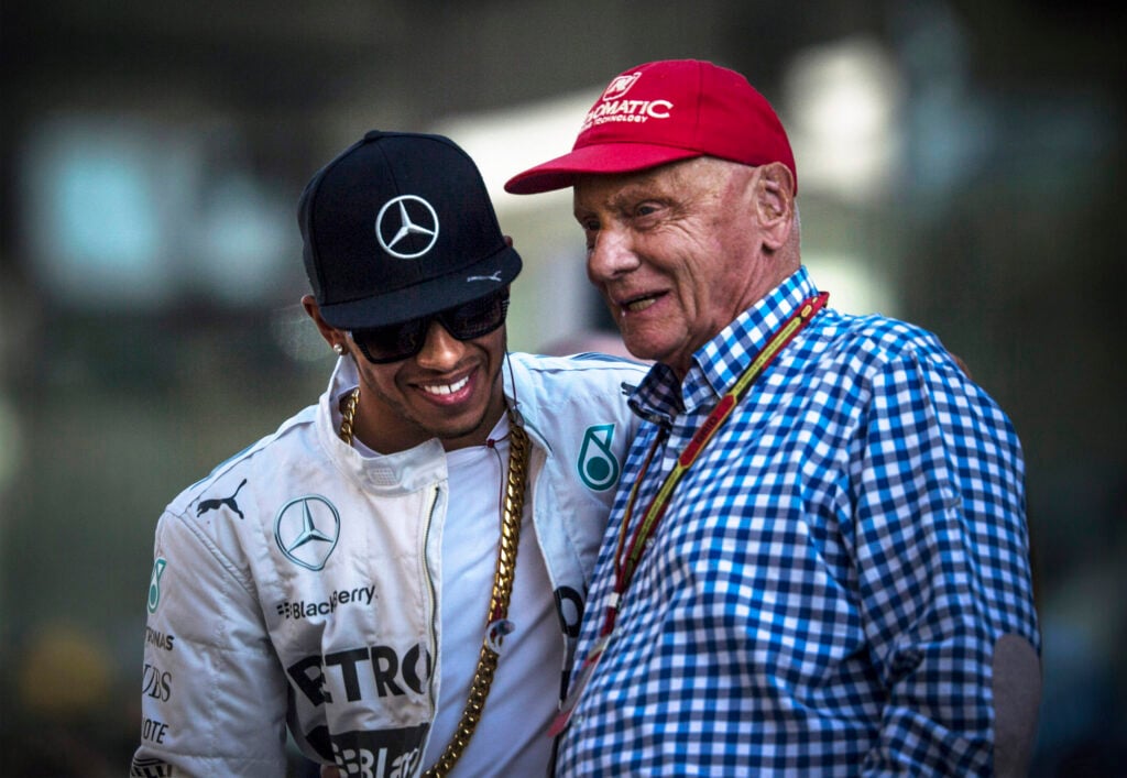 Lewis Hamilton of Mercedes-AMG with NIki Lauda in the F1 paddock at the 2014 Abu Dhabi Grand Prix