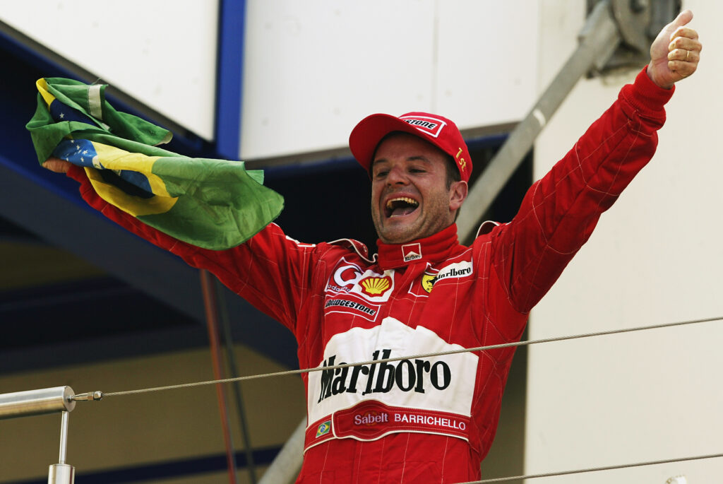 Ferrari driver Rubens Barrichello celebrates on the podium at the 2002 European Grand Prix