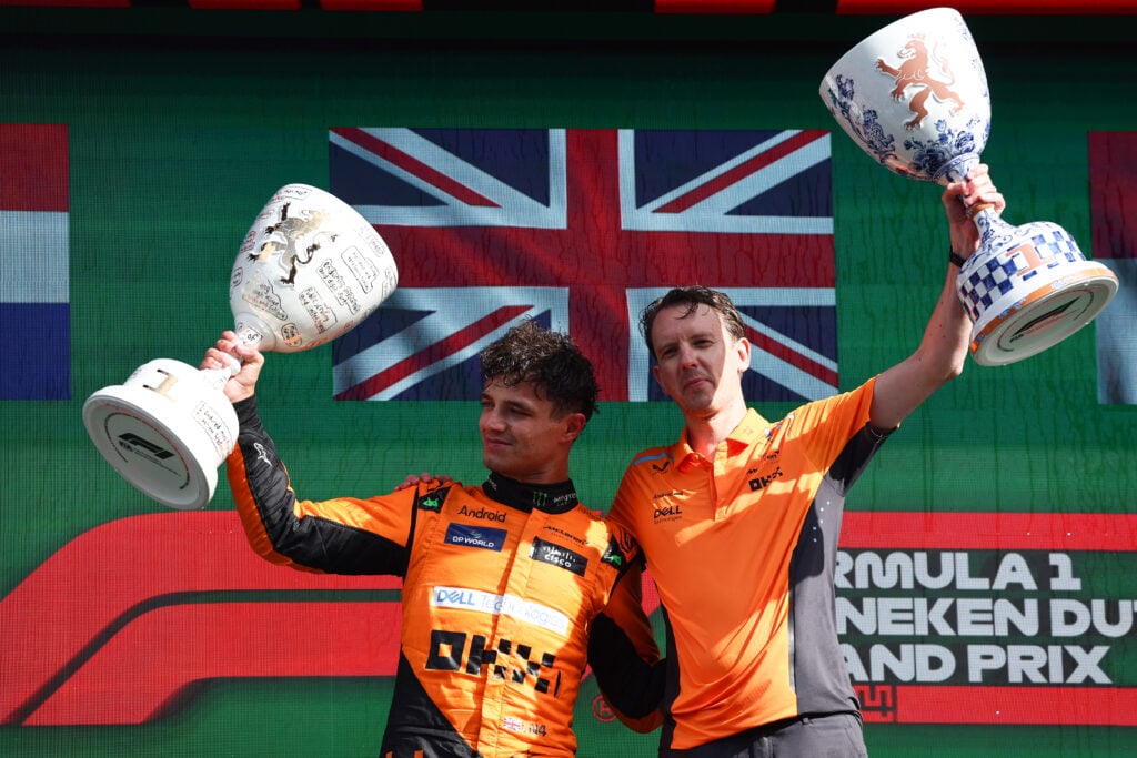 McLaren driver Lando Norris celebrating on the podium at the 2024 Formula 1 Dutch Grand Prix