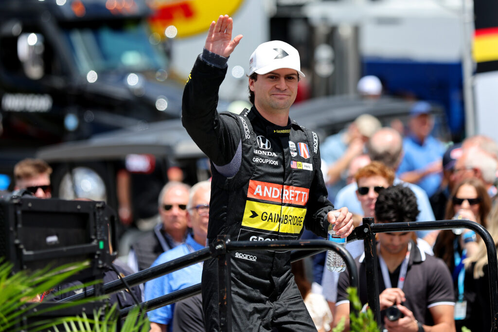 Colton Herta waves to the fans at an IndyCar event