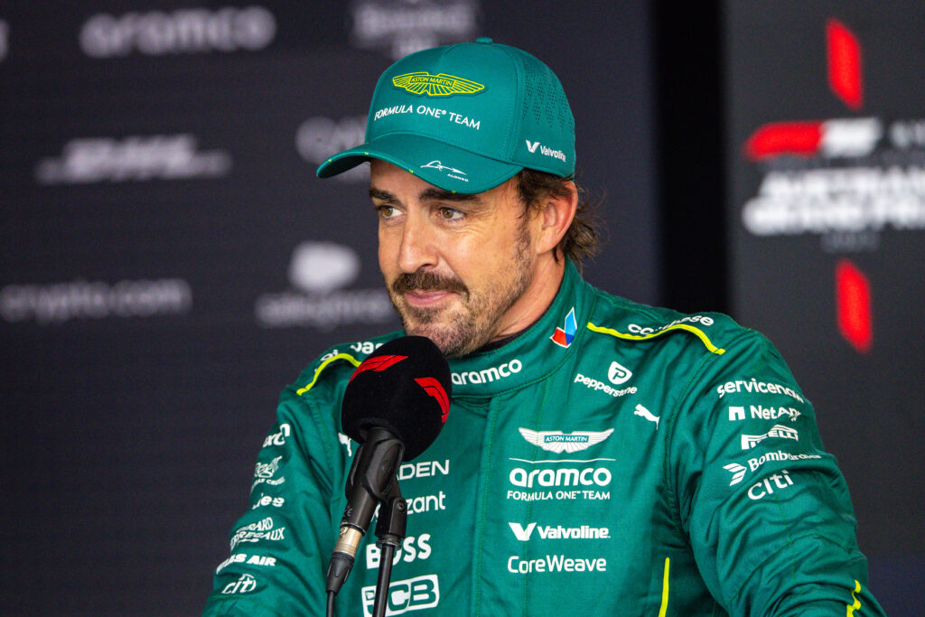 Aston Martin driver Fernando Alonso being interviewed at the 2025 Austrian Grand Prix
