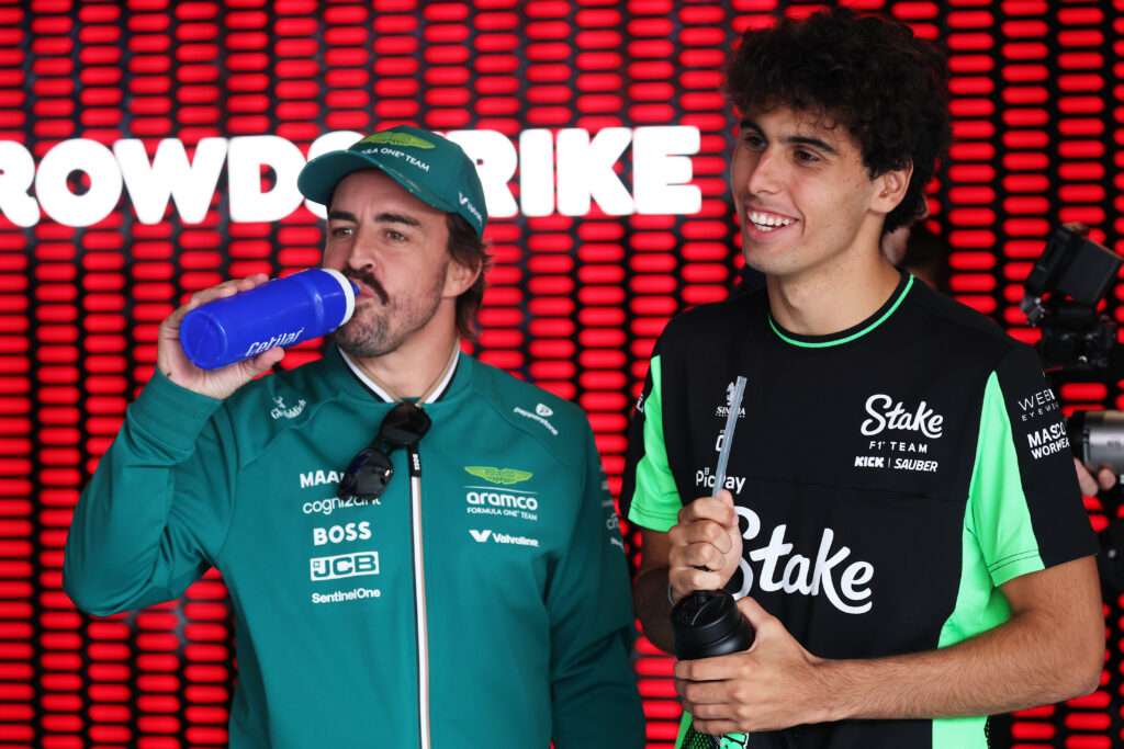 Aston Martin driver Fernando Alonso speaking to Sauber driver Gabriel Bortoleto at the 2025 Formula 1 Hungarian Grand Prix