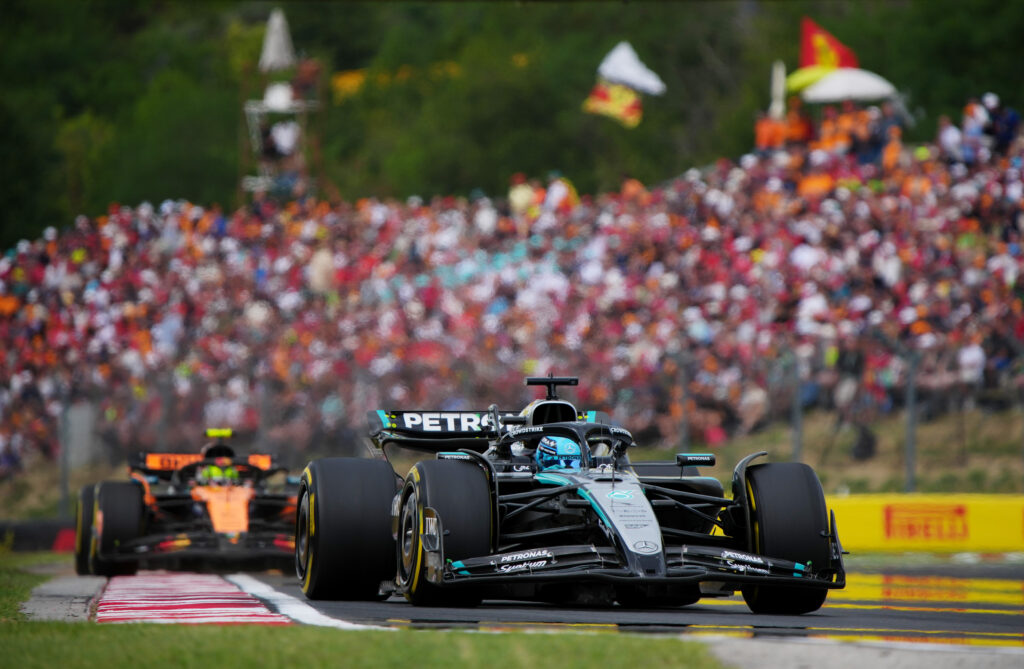 George Russell of Mercedes leads McLaren driver Lando Norris in the 2025 F1 Hungarian Grand Prix
