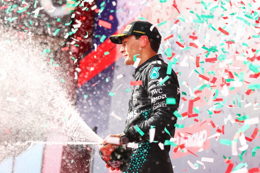 George Russell of Mercedes is showered with confetti on the F1 podium