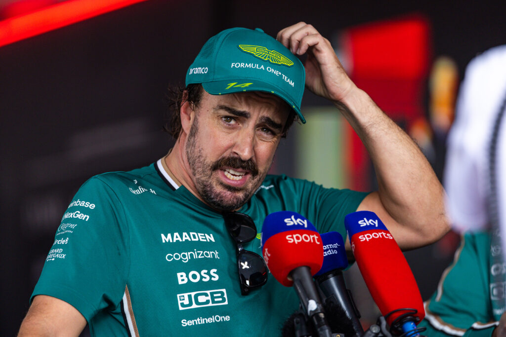 Fernando Alonso of Aston Martin speaks in an interview