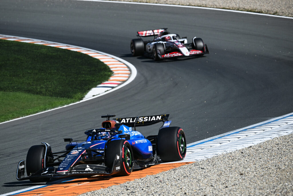 Alex Albon ahead of a Haas f1 car during a practice session at the 2025 Dutch Grand Prix
