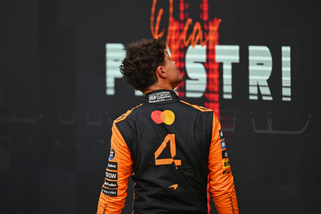Lando Norris of McLaren walks in parc ferme