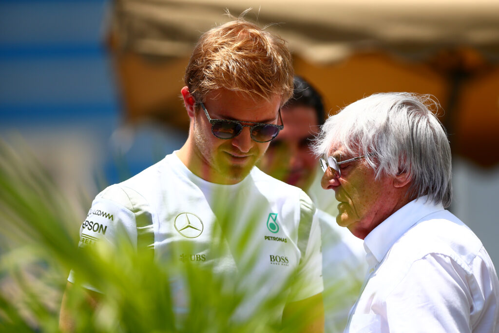 Nico Rosberg and Bernie Ecclestone speaking at the European Grand Prix