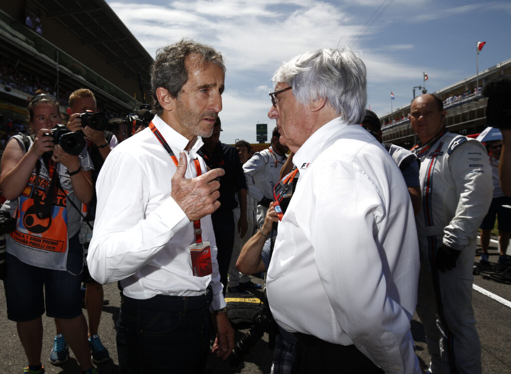 Alain Prost and Bernie Ecclestone speaking at the 2015 Spanish Grand Prix