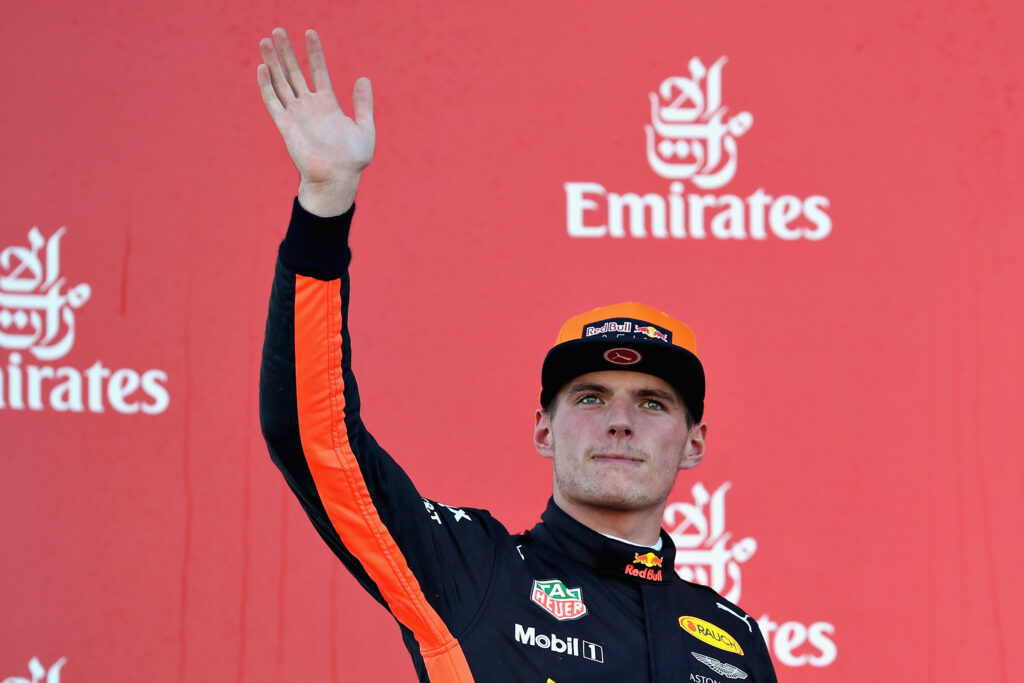 Max Verstappen of Red Bull waves on the F1 podium in 2017