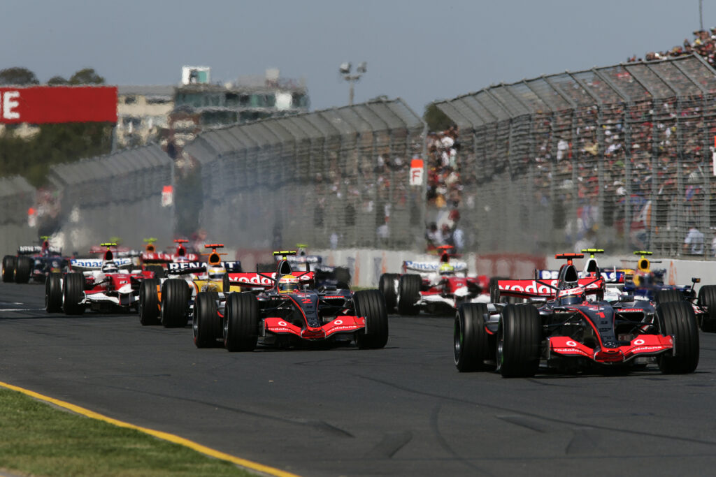 McLaren drivers Fernando Alonso and Lewis Hamilton battle at the start of the 2007 F1 Australian Grand Prix