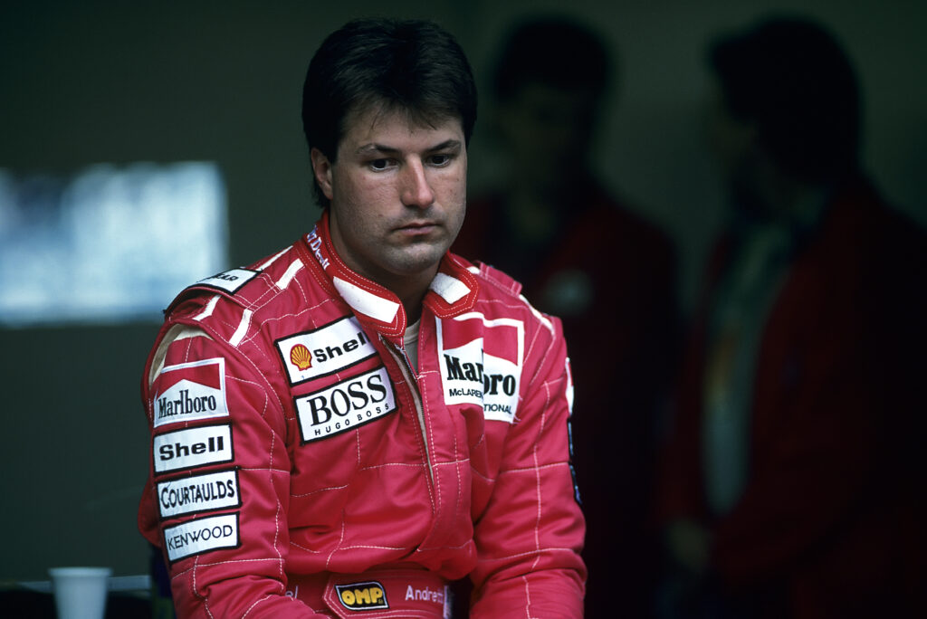 Michael Andretti looks on while wearing McLaren F1 gear