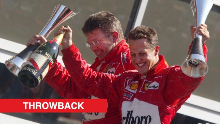 Ferrari driver Michael Schumacher and Ross Brawn celebrating on the podium at the 2003 Italian Grand Prix