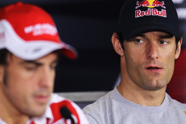 Mark Webber staring at Fernando Alonso during a press conference ahead of the 2010 Abu Dhabi Grand Prix
