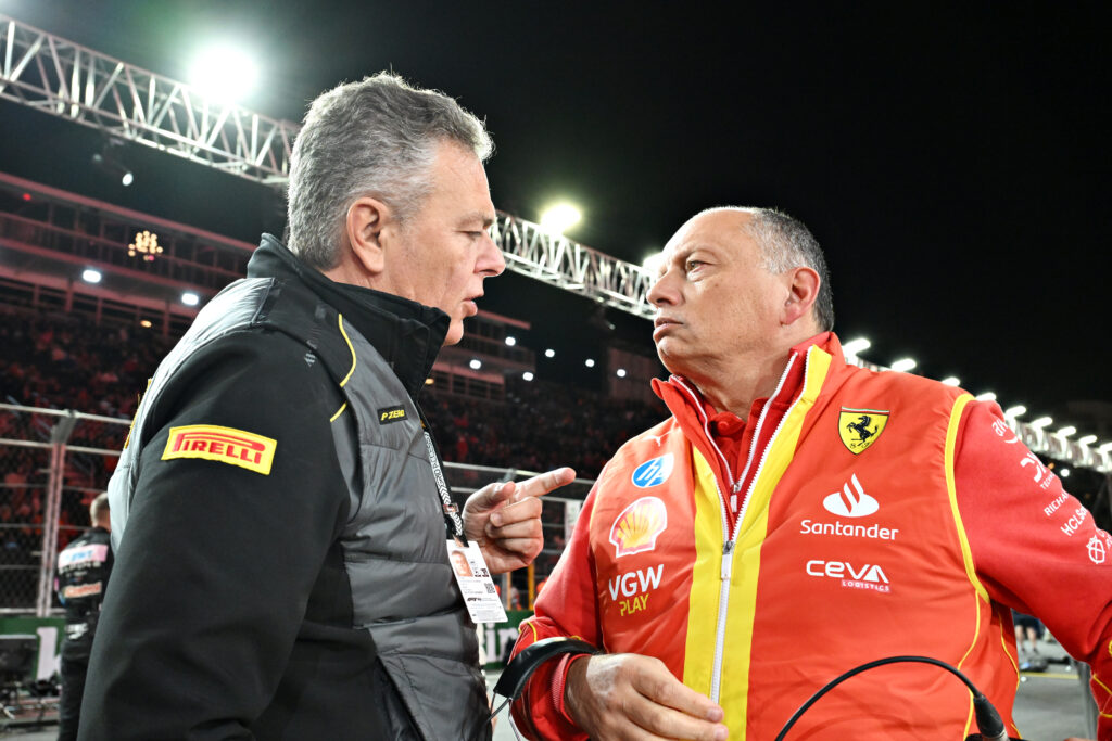 Head of Pirelli Motorsport Mario Isola (left) speaking to Ferrari team principal Fred Vasseur (right) at the 2024 Formula 1 Las Vegas Grand Prix