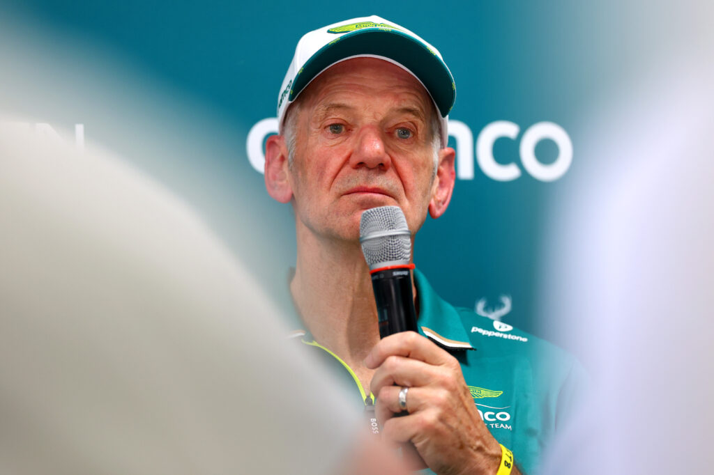 Adrian Newey of Aston Martin takes questions at a press conference