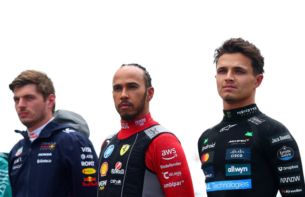 Red Bull driver Max Verstappen (left), Ferrari driver Lewis Hamilton (centre) and McLaren driver Lando Norris (right) lining up on the grid ahead of the 2025 Formula 1 British Grand Prix at Silverstone