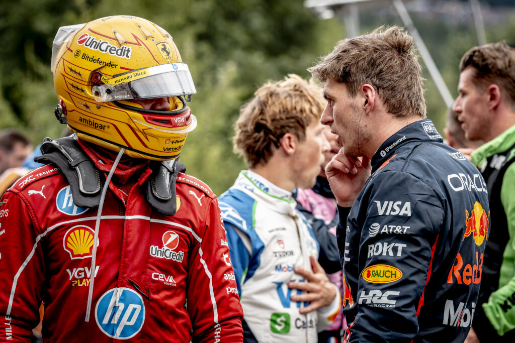 Red Bull driver Max Verstappen speaks to Lewis Hamilton of Ferrari at the 2025 F1 Belgian Grand Prix