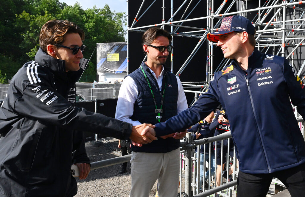 Mercedes driver George Russell (left) shaking hands with Red Bull driver Max Verstappen (right) at the 2025 Formula 1 Belgian Grand Prix