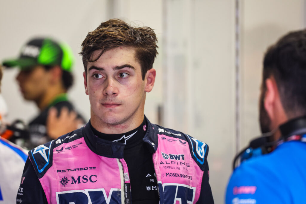 Alpine driver Franco Colapinto with his race suit undone after taking part in the 2025 Formula 1 Belgian Grand Prix