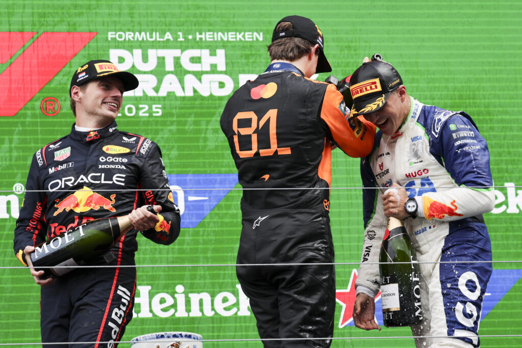Max Verstappen, Oscar Piastri and Isack Hadjar on the podium at the 2025 Formula 1 Dutch Grand Prix