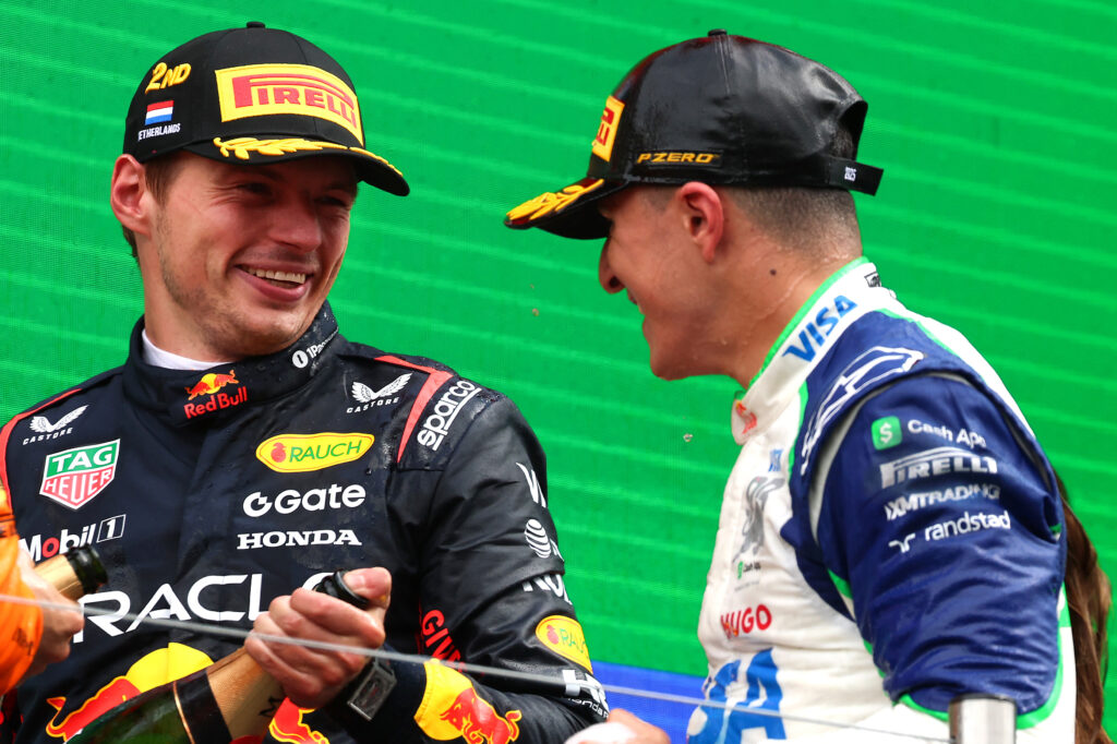 Max Verstappen and Isack Hadjar celebrating their podiums at the 2025 Dutch Grand Prix