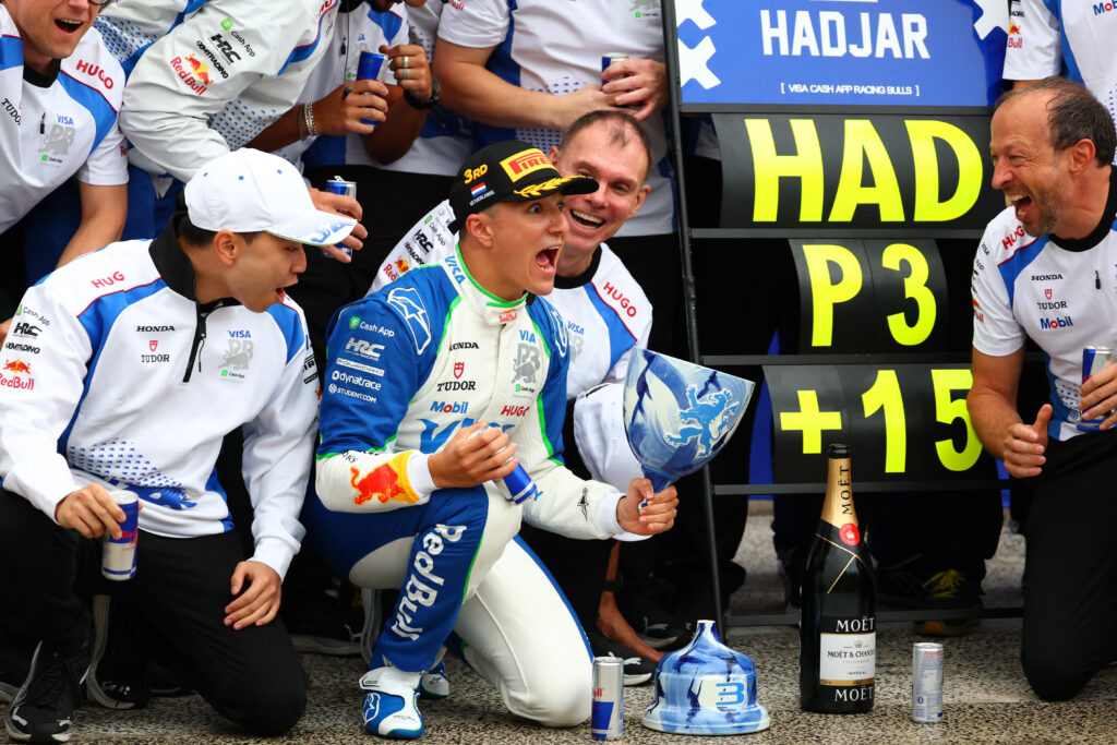 Isack Hadjar celebrates with his Racing Bulls team at the 2025 Dutch Grand Prix