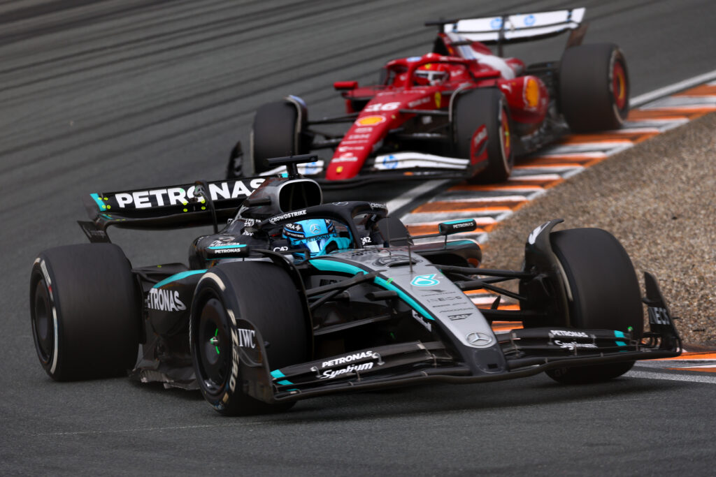 George Russell races with Charles Leclerc in the 2025 Dutch Grand Prix