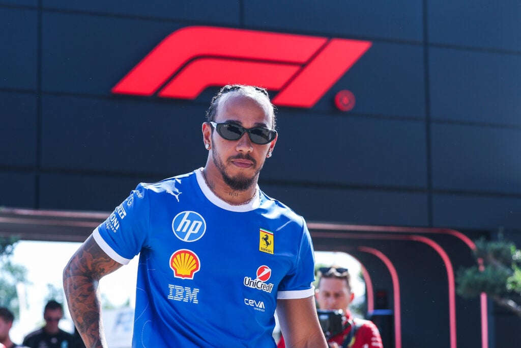 Lewis Hamilton of Ferrari arrives in the F1 paddock