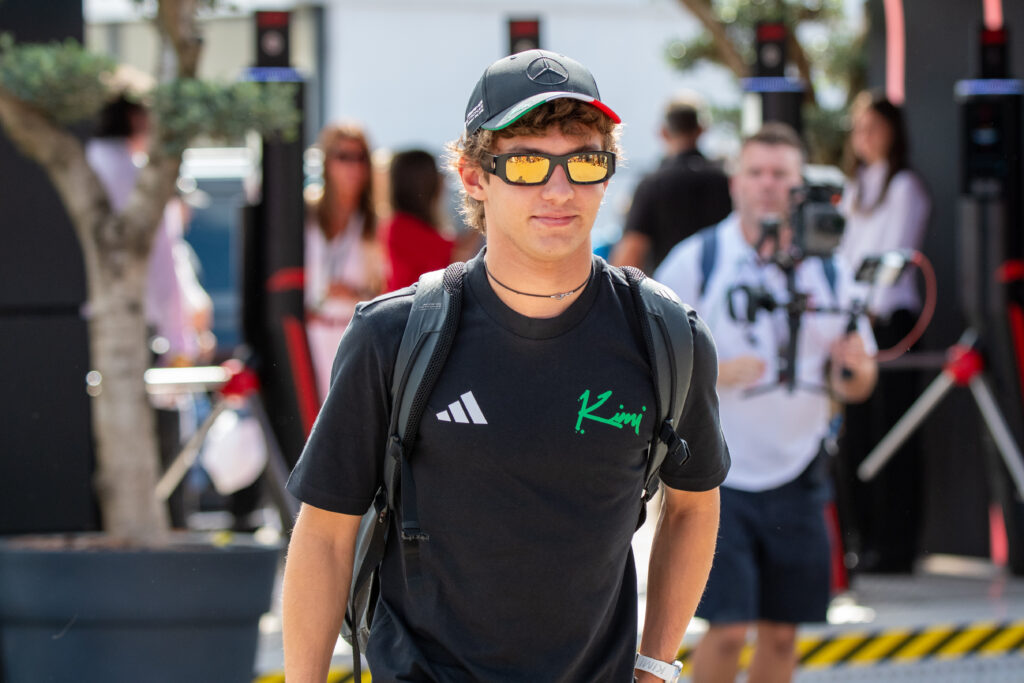 Mercedes driver Andrea Kimi Antonelli walking through the paddock wearing sunglasses at the 2025 Formula 1 Italian Grand Prix