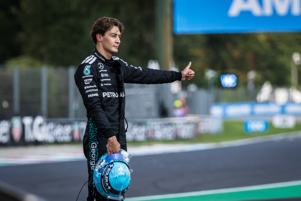 Mercedes driver George Russell gestures for a lift after a car failure during practice at Monza for the 2025 F1 Italian Grand Prix