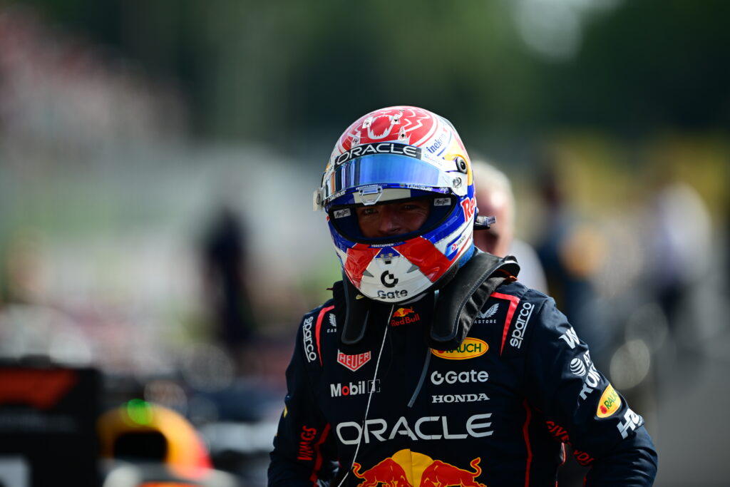 Red Bull Racing driver Max Verstappen wearing his helmet after winning the 2025 Formula 1 Italian Grand Prix