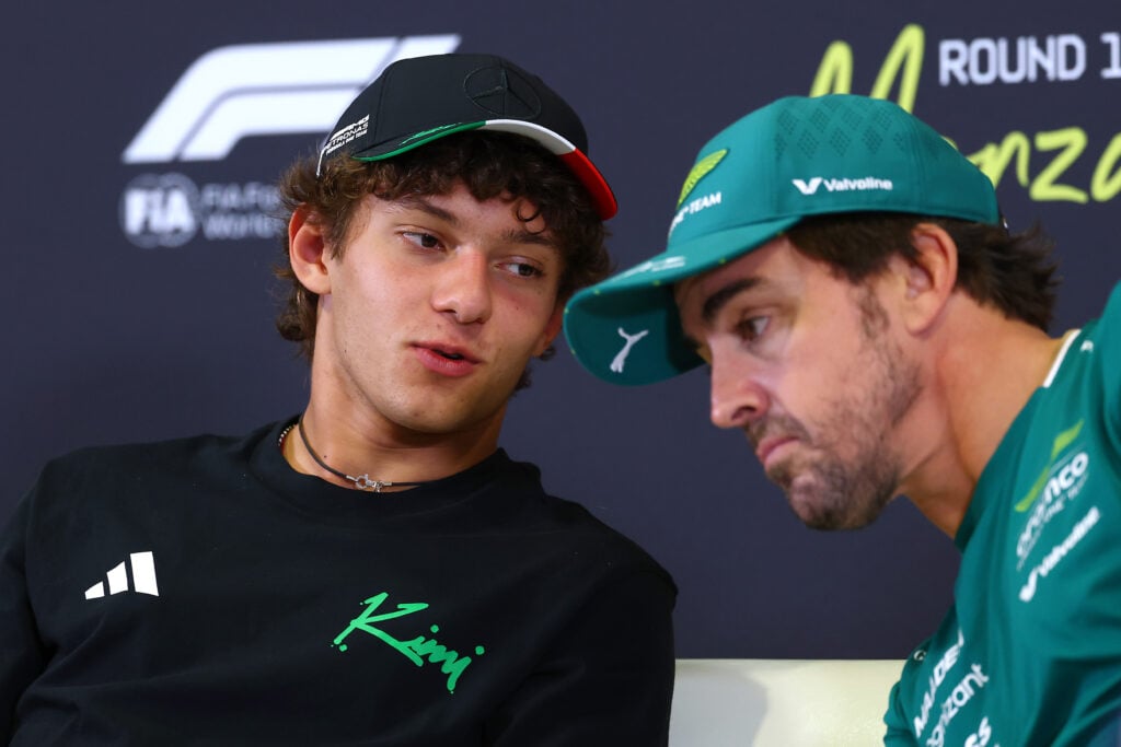 Andrea Kimi Antonelli of Mercedes speaks to Aston Martin driver Fernando Alonso in the pre-race press conference at the F1 2025 Italian Grand Prix at Monza