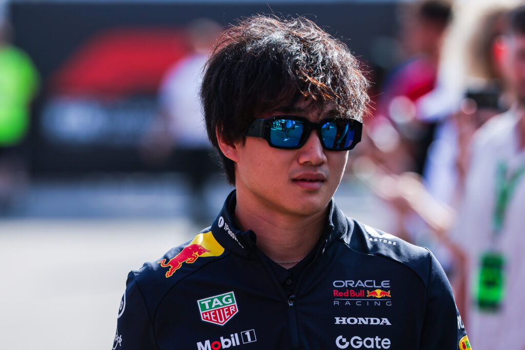 Red Bull Racing driver Yuki Tsunoda wearing sunglasses in the paddock at the 2025 Formula 1 Italian Grand Prix