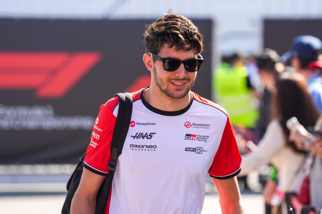 Haas driver Esteban Ocon walks through the Monza paddock at the 2025 Italian Grand Prix