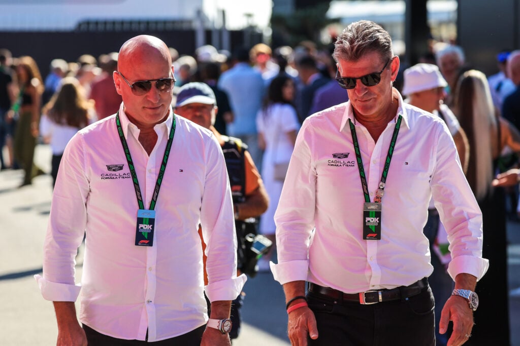 Cadillac CEO Dan Towriss (left) walking through the paddock at the 2025 Italian Grand Prix with Cadillac F1 team principal Graeme Lowdon (right).