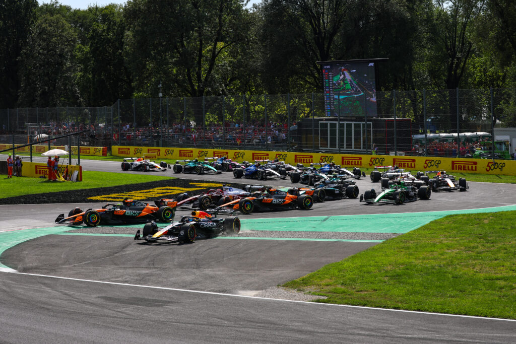 Red Bull driver Max Verstappen cutting the corner at the start of the 2025 Formula 1 Italian Grand Prix