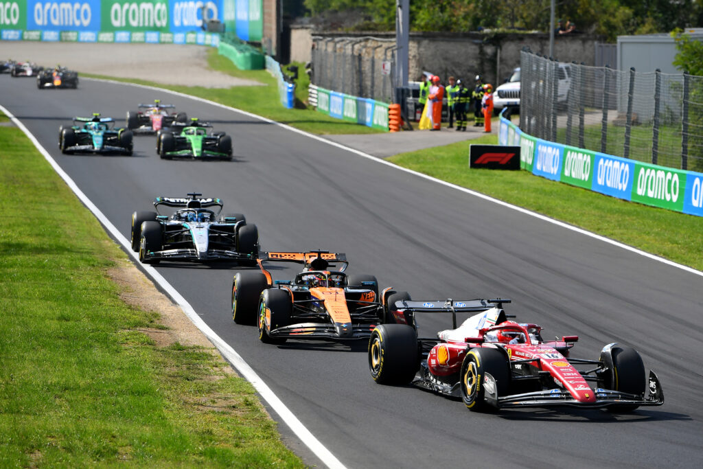 Charles Leclerc leads Oscar Piastri and George Russell at the 2025 Italian GP.