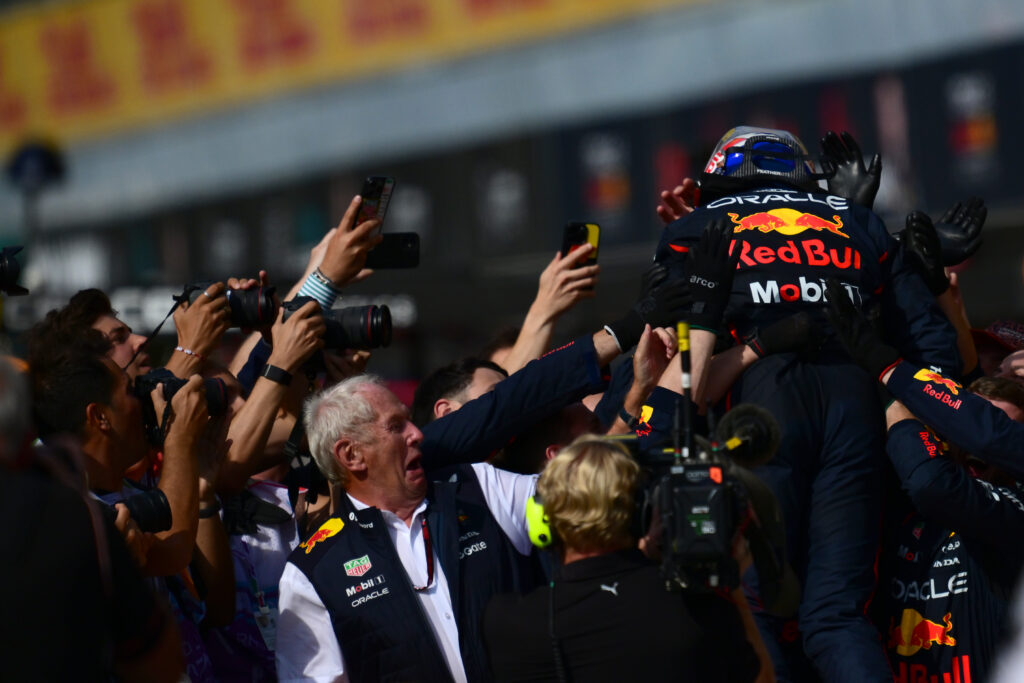 Red Bull advisor Helmut Marko watching driver Max Verstappen jump into a crowd of mechanics after winning the 2025 Formula 1 Italian Grand Prix