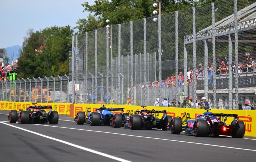 Red Bull's Yuki Tsunoda and Max Verstappen, Williams' Carlos Sainz and Alpine's Franco Colapinto leave the Monza pit lane before the 2025 F1 Italian Grand Prix
