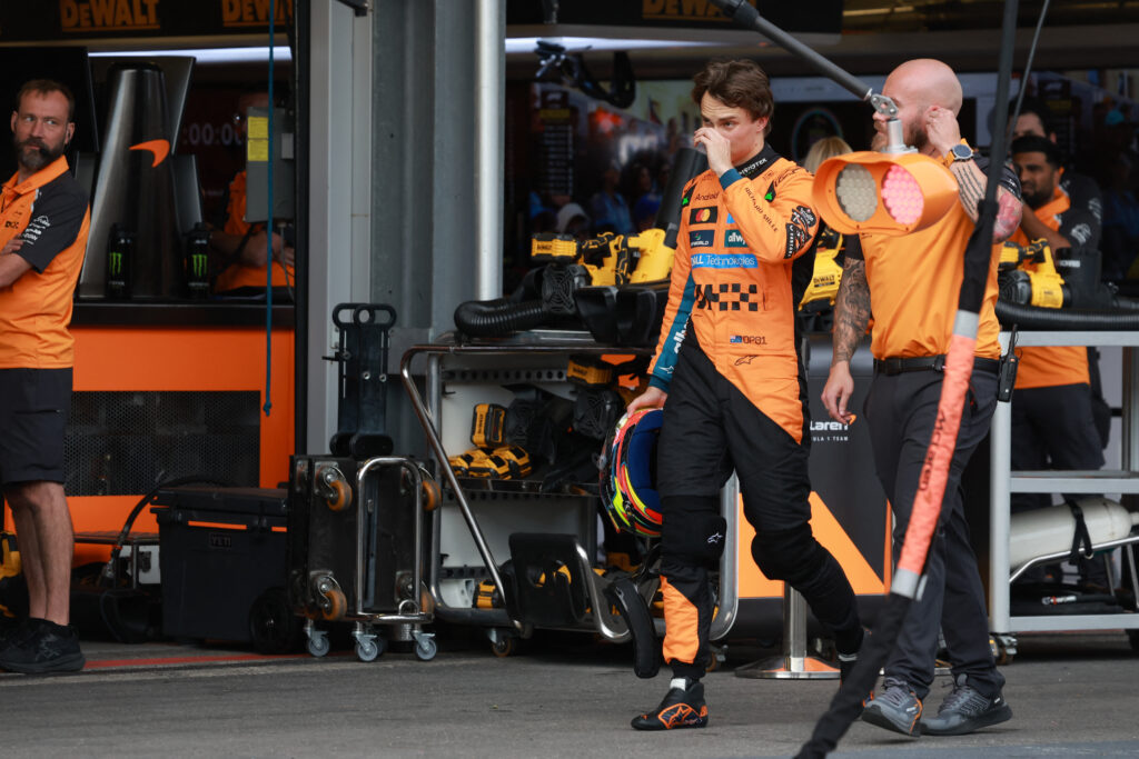 McLaren driver Oscar Piastri walks through the Baku pit lane after crashing in qualifying for the 2025 F1 Azerbaijan Grand Prix