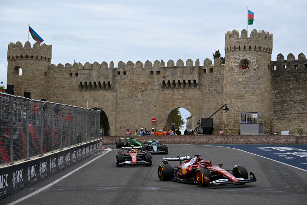 Charles Leclerc leads Ferrari teammate Lewis Hamilton on track in Baku during the 2025 F1 Azerbaijan Grand Prix