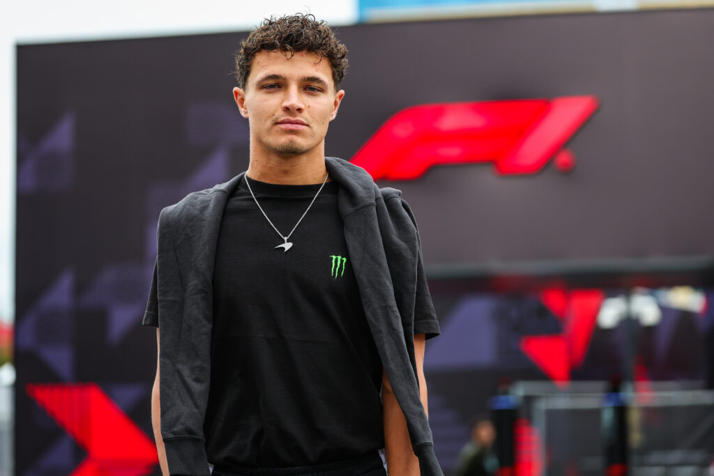 McLaren driver Lando Norris arriving in the paddock on media day for the 2025 Formula 1 Azerbaijan Grand Prix