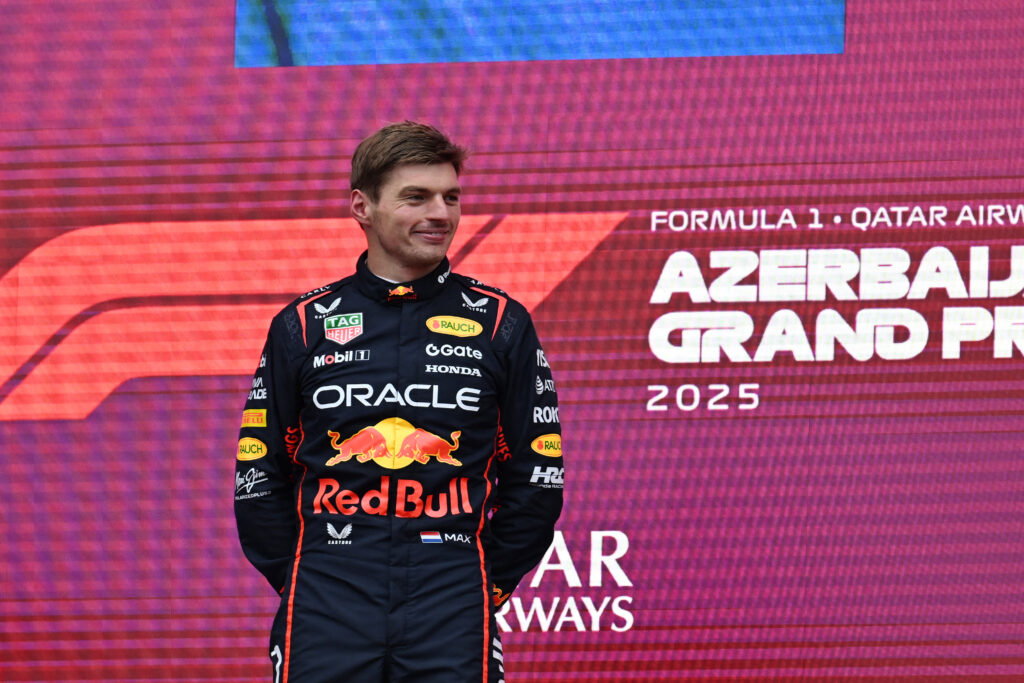 Red Bull driver Max Verstappen standing on the podium at the 2025 Formula 1 Azerbaijan Grand Prix