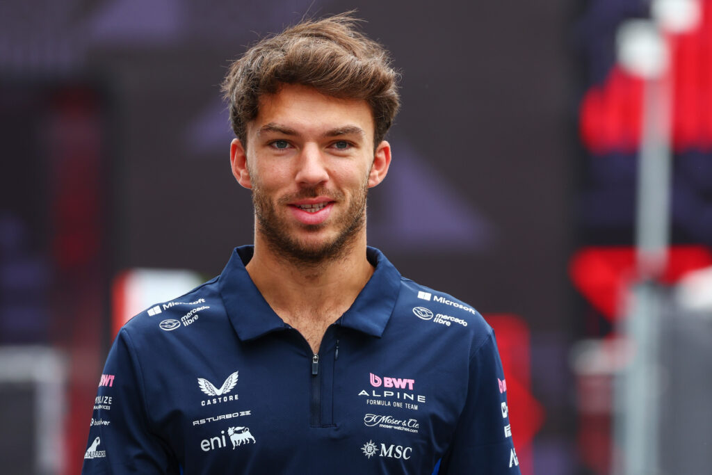 Pierre Gasly of Alpine smiles in the Azerbaijan Grand Prix paddock